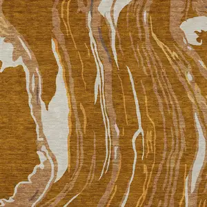 Photo of Brown Gold And Copper Abstract Washable Indoor Outdoor Area Rug