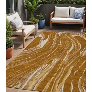Photo of Brown Gold And Copper Abstract Washable Indoor Outdoor Area Rug