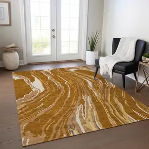 Photo of Brown Gold And Copper Abstract Washable Indoor Outdoor Area Rug