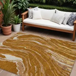Photo of Brown Gold And Copper Abstract Washable Indoor Outdoor Area Rug
