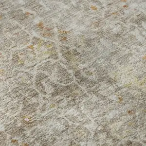 Photo of Brown Gold And Orange Oriental Washable Area Rug With UV Protection