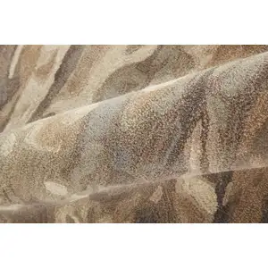 Photo of Brown Gray And Tan Wool Abstract Tufted Handmade Stain Resistant Area Rug