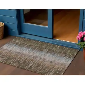 Photo of Brown Green And Ivory Abstract Washable Indoor Outdoor Area Rug