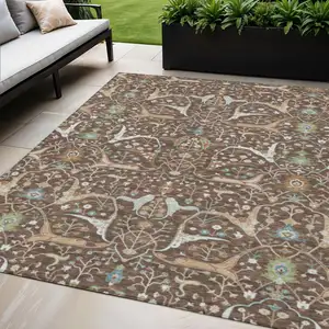 Photo of Brown Green And Ivory Floral Washable Indoor Outdoor Area Rug