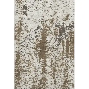 Photo of Brown Ivory And Beige Abstract Washable Area Rug With UV Protection