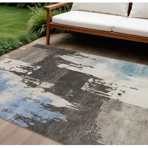 Photo of Brown Ivory And Blue Abstract Washable Indoor Outdoor Area Rug