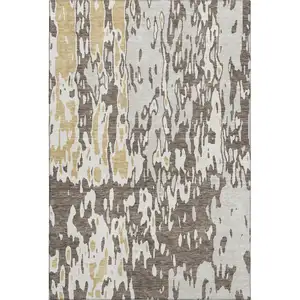 Photo of Brown Ivory And Gold Abstract Washable Area Rug With UV Protection
