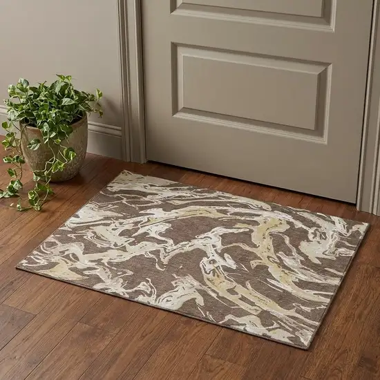 Brown Ivory And Gold Abstract Washable Area Rug With UV Protection Photo 1