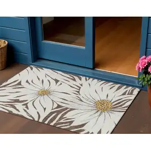 Photo of Brown Ivory And Gold Floral Washable Indoor Outdoor Area Rug