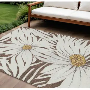 Photo of Brown Ivory And Gold Floral Washable Indoor Outdoor Area Rug