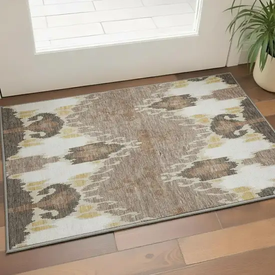 Brown Ivory And Gold Ikat Washable Area Rug With UV Protection Photo 2