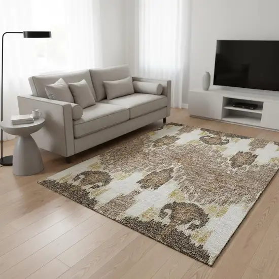 Brown Ivory And Gold Ikat Washable Area Rug With UV Protection Photo 2