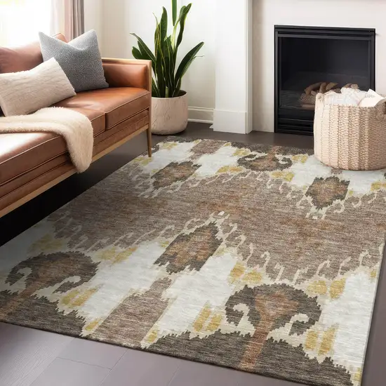 Brown Ivory And Gold Ikat Washable Area Rug With UV Protection Photo 6