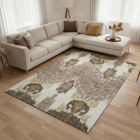 Brown Ivory And Gold Ikat Washable Area Rug With UV Protection Photo 2