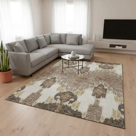 Brown Ivory And Gold Ikat Washable Area Rug With UV Protection Photo 2