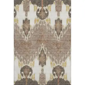 Photo of Brown Ivory And Gold Ikat Washable Area Rug With UV Protection