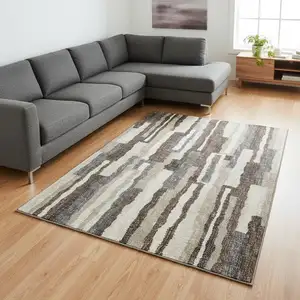 Photo of Brown Ivory And Gray Abstract Washable Area Rug With UV Protection