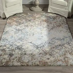 Photo of Brown Light Blue And Gray Distressed Diamond Area Rug