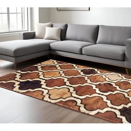Brown And Ivory Quatrefoil Distressed Area Rug Photo 1
