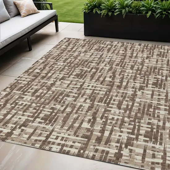 Brown Tan And Beige Abstract Washable Indoor Outdoor Area Rug Photo 1