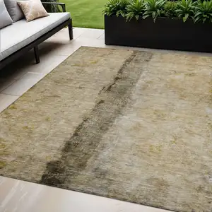 Photo of Brown Taupe And Gold Abstract Washable Indoor Outdoor Area Rug