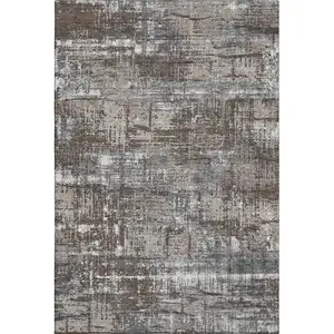 Photo of Brown Taupe And Gray Geometric Washable Area Rug With UV Protection