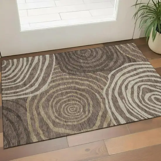 Brown Taupe And Ivory Abstract Washable Area Rug With UV Protection Photo 1