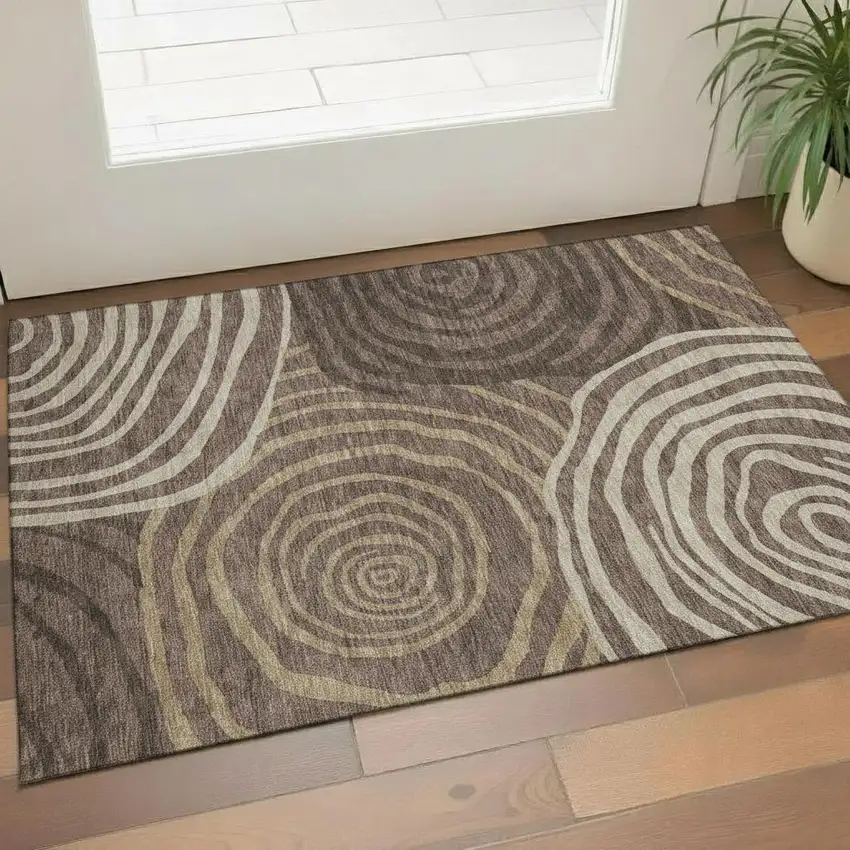 Brown Taupe And Ivory Abstract Washable Area Rug With UV Protection Photo 1