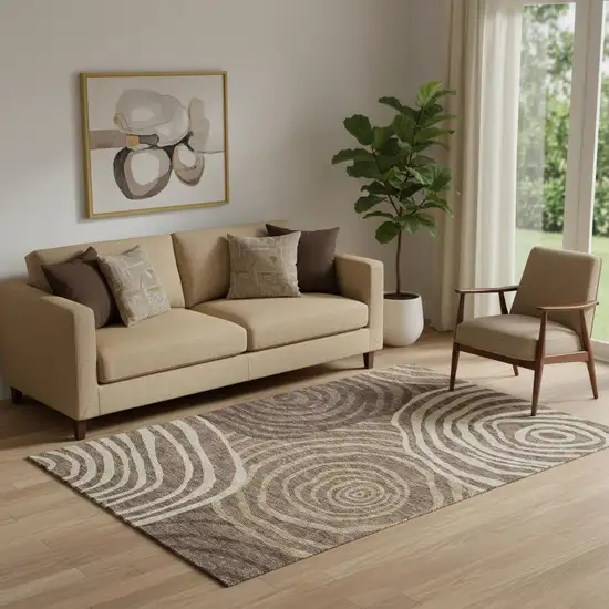 Brown Taupe And Ivory Abstract Washable Area Rug With UV Protection Photo 1