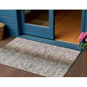 Photo of Brown Taupe And Ivory Abstract Washable Indoor Outdoor Area Rug