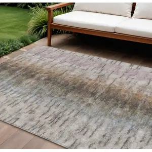 Photo of Brown Taupe And Ivory Abstract Washable Indoor Outdoor Area Rug