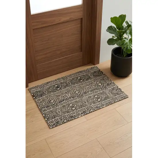 Brown Taupe And Ivory Striped Stain Resistant Area Rug Photo 1