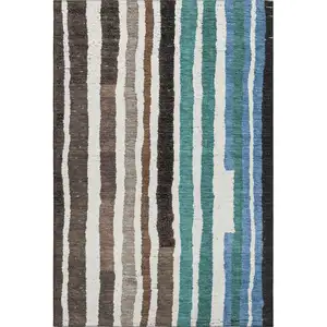 Photo of Brown Teal And Ivory Striped Washable Area Rug With UV Protection