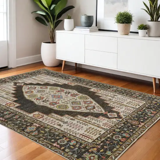 Green and Ivory Wool Floral Hand Knotted Distressed Area Rug With Fringe Photo 1