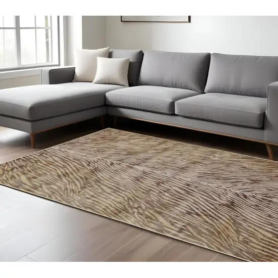 Brown and Tan Animal Print Power Loom Area Rug Photo 1