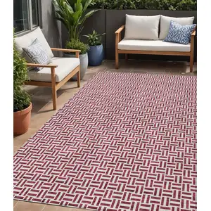 Photo of Burgundy And Ivory Geometric Washable Indoor Outdoor Area Rug