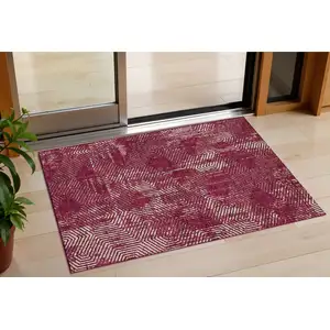 Photo of Burgundy And Ivory Geometric Washable Indoor Outdoor Area Rug