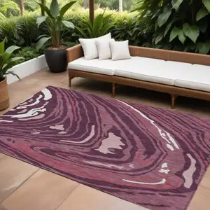Photo of Burgundy Brick Red And Ivory Abstract Washable Indoor Outdoor Area Rug