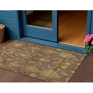 Photo of Burgundy Gold And Copper Ikat Washable Indoor Outdoor Area Rug