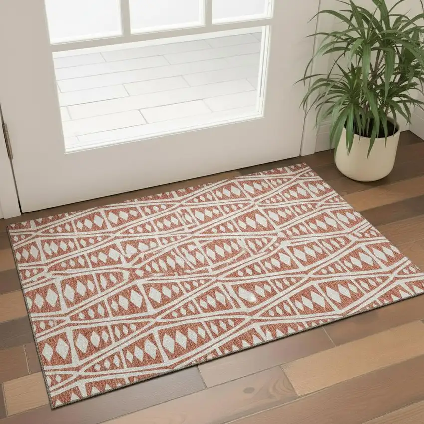 Burnt Sienna And Ivory Tribal Washable Area Rug With UV Protection Photo 1