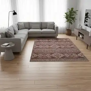 Photo of Burnt Sienna And Ivory Tribal Washable Area Rug With UV Protection