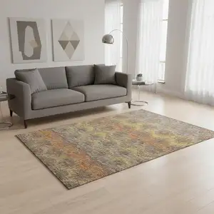 Photo of Burnt Sienna Gold And Gray Abstract Washable Area Rug With UV Protection