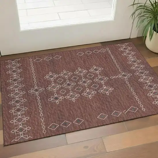 Burnt Sienna Ivory And Black Tribal Washable Area Rug With UV Protection Photo 1