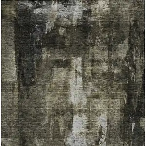 Photo of Charcoal And Black Abstract Washable Indoor Outdoor Area Rug