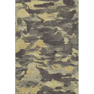 Photo of Charcoal And Gold Abstract Washable Area Rug With UV Protection