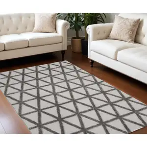 Photo of Charcoal And Gray Geometric Shag Area Rug