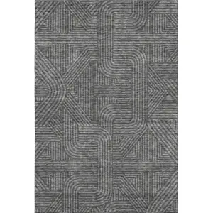 Photo of Charcoal And Ivory Abstract Geometric Washable Area Rug With UV Protection