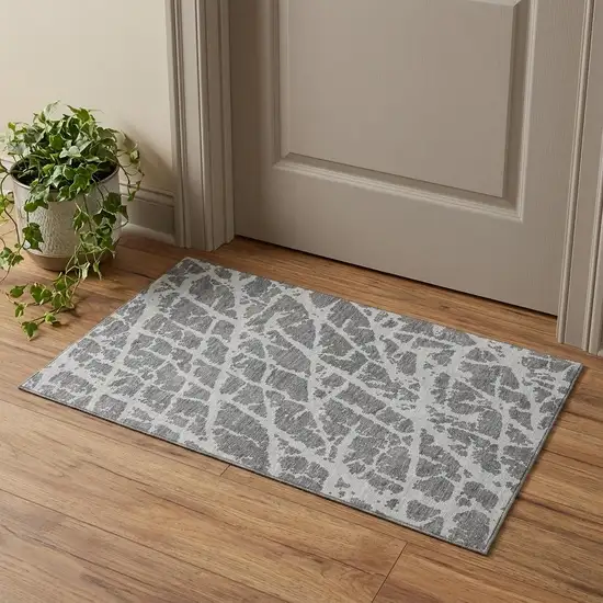 Charcoal And Ivory Abstract Washable Area Rug With UV Protection Photo 1