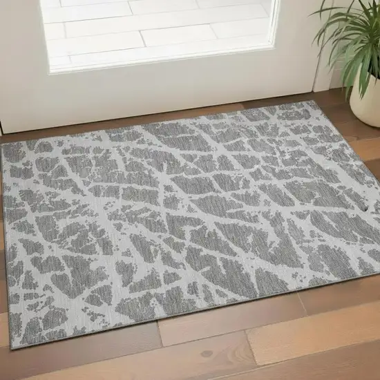 Charcoal And Ivory Abstract Washable Area Rug With UV Protection Photo 1