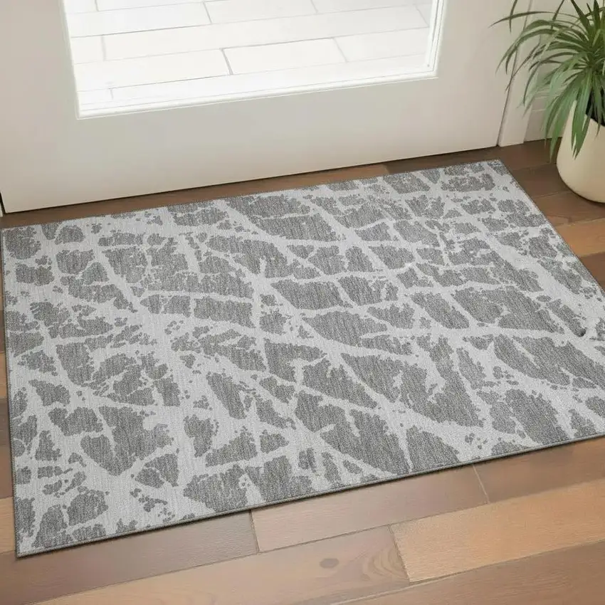 Charcoal And Ivory Abstract Washable Area Rug With UV Protection Photo 1